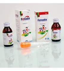 Two bottles and boxes of Fenadin fexofenadine oral suspension syrup for kids.