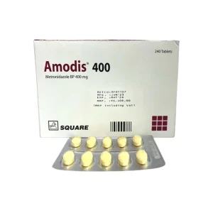 A white box of Amodis 400mg Metronidazole tablets with a blister pack of yellow pills in front.