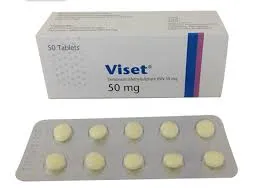 A top-down view showing a white Viset 50 mg medication box with blue and purple stripes above a silver blister strip containing ten round, yellowish-white pills against a white background.