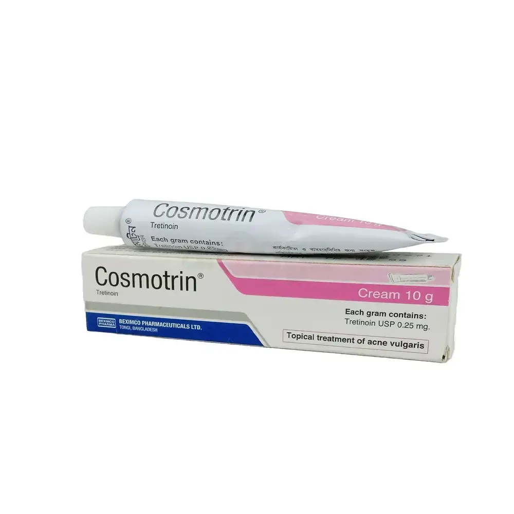 A white and pink tube of Cosmotrin Tretinoin cream resting on its original cardboard box, labeled as a topical treatment for acne vulgaris.