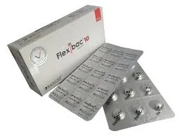 An angled view of a Flexibac 10 medicine box next to silver blister strips showing individual round tablets.