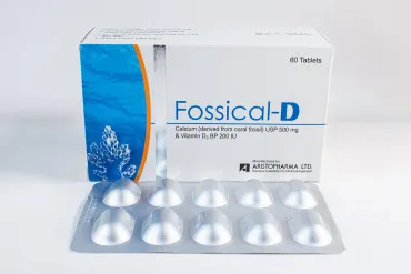A white and blue box of Fossical-D tablets placed behind a silver blister pack of medicine.