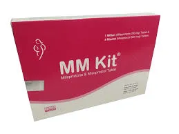 A pink and white medical box labeled "MM Kit," which contains Mifepristone and Misoprostol tablets.