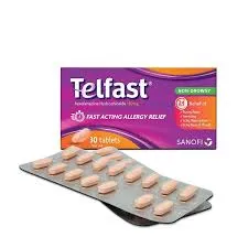 A purple and orange box of Telfast non-drowsy allergy relief medicine next to a silver blister pack of peach-colored tablets.