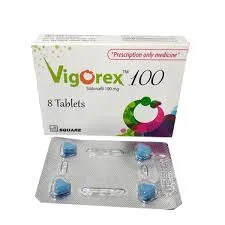 A white box of VigoRex 100 mg medication labeled as "Prescription only medicine" and "8 Tablets." Below the box is a silver blister pack containing four blue, diamond-shaped pills.