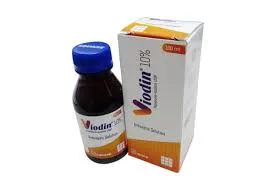 A dark brown 100ml glass bottle with a blue cap next to its white and orange box for Viodin 10% Povidone-Iodine antiseptic solution.