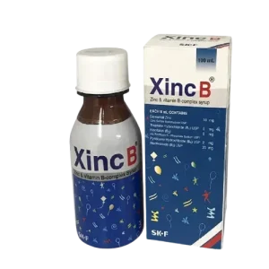 A 100ml bottle and its cardboard packaging of Xinc B, a Zinc and Vitamin B-complex supplement manufactured by SK+F, shown against a white background.