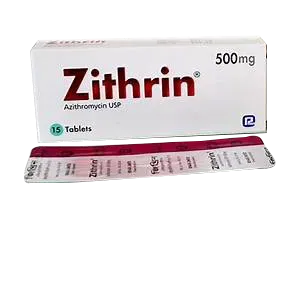 A white box and partial blister pack of Zithrin 500mg, a prescription antibiotic medication containing Azithromycin USP.