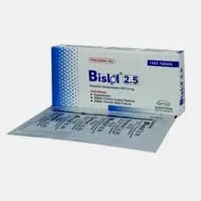 An angled perspective of a Bislol 2.5 mg box placed next to a silver foil blister strip containing individual tablets.