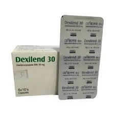 A white box of Dexilend 30 capsules standing next to a silver foil medicine blister strip.