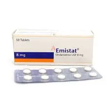 A white rectangular medication box labeled Emistat Ondansetron USP 8 mg, showing a 50-tablet count, placed behind a silver blister strip with ten white circular pills.