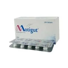 A white box of Motigut tablets positioned behind a silver foil blister pack containing several white pills.